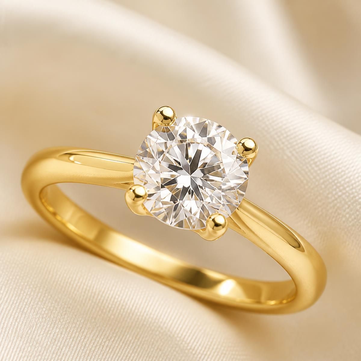 Yellow gold solitaire engagement ring with a round brilliant diamond